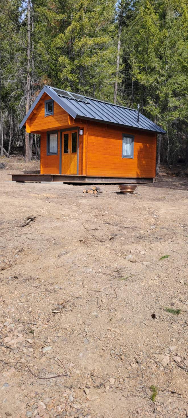 Angled side view of the off-grid cabin at Big Cat Ranch near Tulameen BC
