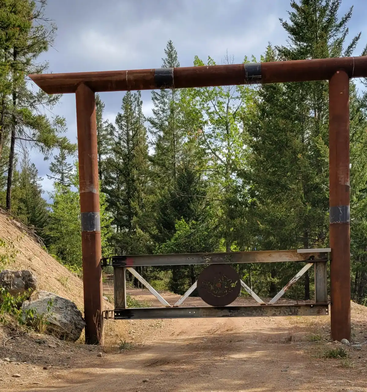 Entrance gate to Big Cat Ranch on Cook Creek Forest Service Road near Coalmont, British Columbia